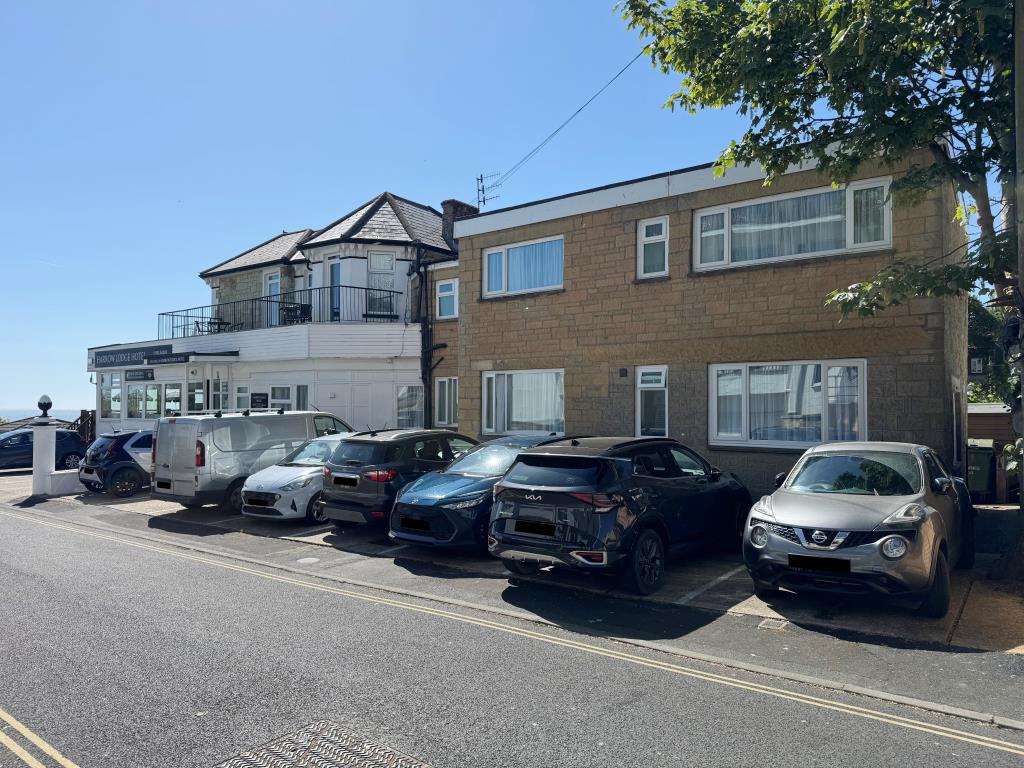 Lot: 48 - FREEHOLD CLIFF TOP HOTEL WITH TWENTY EN-SUITE GUEST ROOMS AND STUNNING VIEWS - A Look at the Property from the Side Elevation